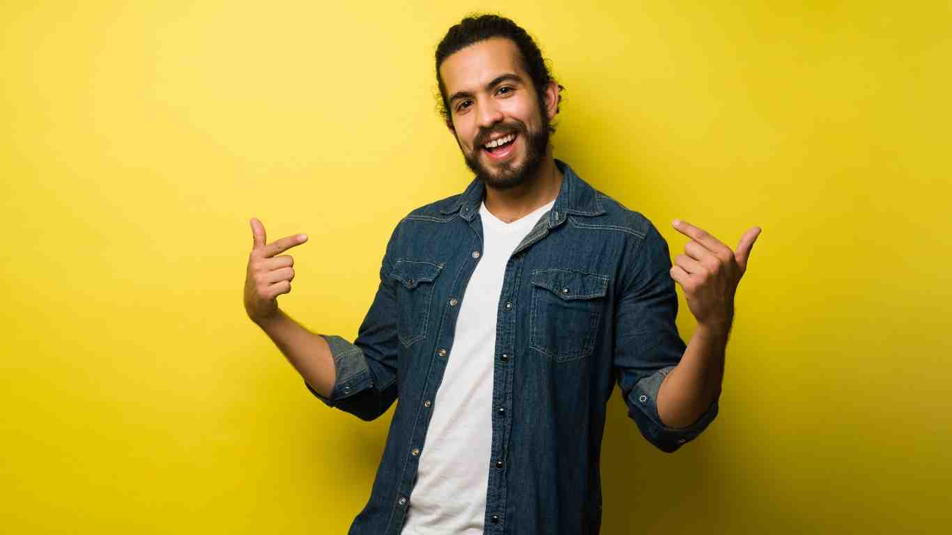 Person smiling confidently with porcelain veneers - porcelain veneer cost